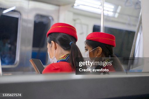 Passenger using mobile device while stay on public transportation. Passenger using mobile device while stay on public transportation.