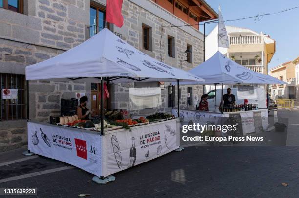 Two of the stalls that make up the market La Despensa de Madrid, in the Plaza de la Constitucion in Moralzarzal, on 22 August, 2021 in Moralzarzal,...