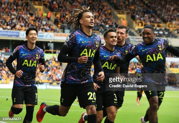 Dele Alli of Tottenham Hotspur celebrates after scoring their side's first goal from the penalty spot during the Premier League match between...