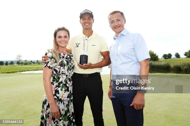 Johannes Veerman of United States poses with the trophy after winning the D+D Real Czech Masters alongside Eva Kynclova and title sponsor Petr Dedek,...