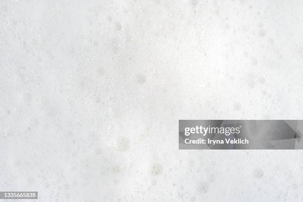 soap bubbles from foam bath or antibacterial gel. - seife stock-fotos und bilder