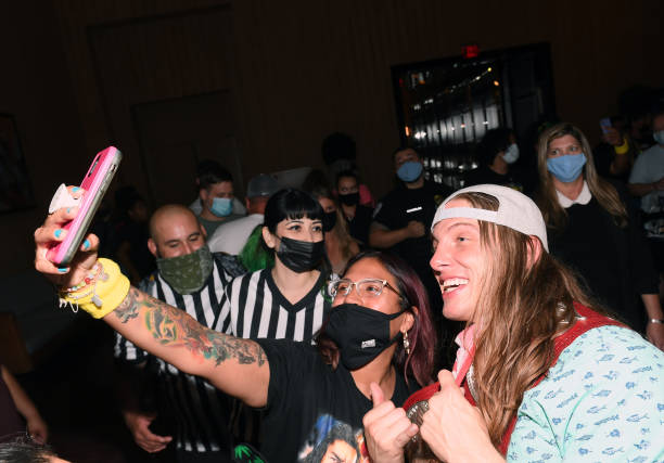 Professional wrestler and former mixed martial artist Matt "Riddle" Riddle takes a selfie with fans during the WWE SummerSlam after party at Delano...