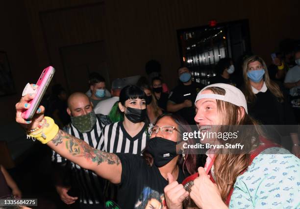 Professional wrestler and former mixed martial artist Matt "Riddle" Riddle takes a selfie with fans during the WWE SummerSlam after party at Delano...