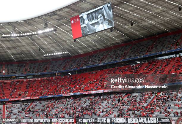 Tributes are displayed inside the stadium to former footballer, Gerd Muller who recently passed away prior to the Bundesliga match between FC Bayern...