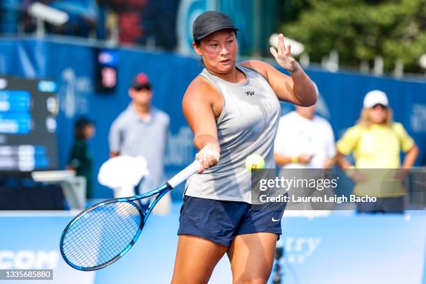 Tara Moore of Great Britain returns the ball to Catherine Harrison of USA during the first set of their match at Jacobs Pavilion on August 22, 2021...