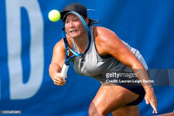 Tara Moore of Great Britain backhands the ball during the first set of her match against Catherine Harrison of USA at Jacobs Pavilion on August 22,...