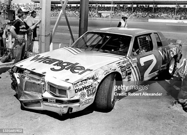 Driver Dale Earnhardt Sr. Exits the racetrack after being involved in an accident during the running of the 1981 Firecracker 400 race at Daytona...