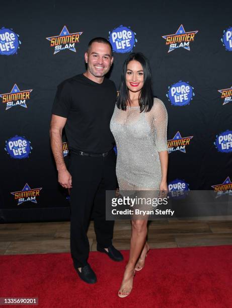 Television personality J.J. Garcia and professional wrestler and television personality Nikki Bella attend the WWE SummerSlam after party at Delano...