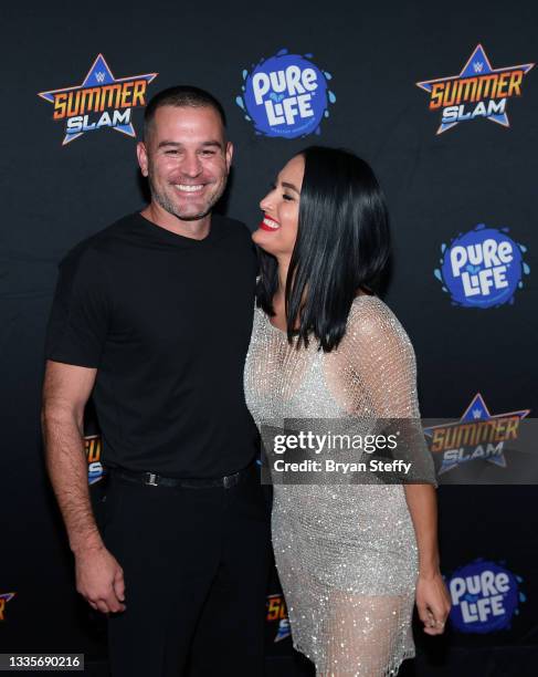 Television personality J.J. Garcia and professional wrestler and television personality Nikki Bella attend the WWE SummerSlam after party at Delano...