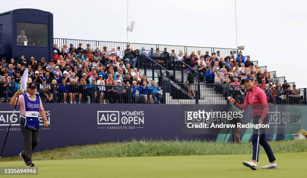 Georgia Hall of England acknowledges the crowd on to the 18th green during the final round of the AIG Women's Open at Carnoustie Golf Links on August...