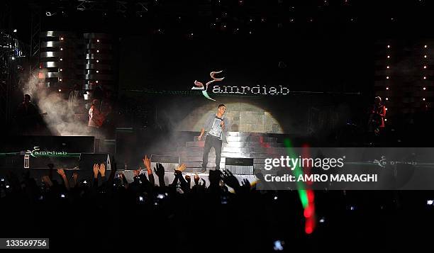 Egyptain pop star Amr Diab is seen performing in the coastal resort of Ain al-Sukhna, east of Cairo, late on November 7, 2011. AFP PHOTO/AMRO MARAGHI