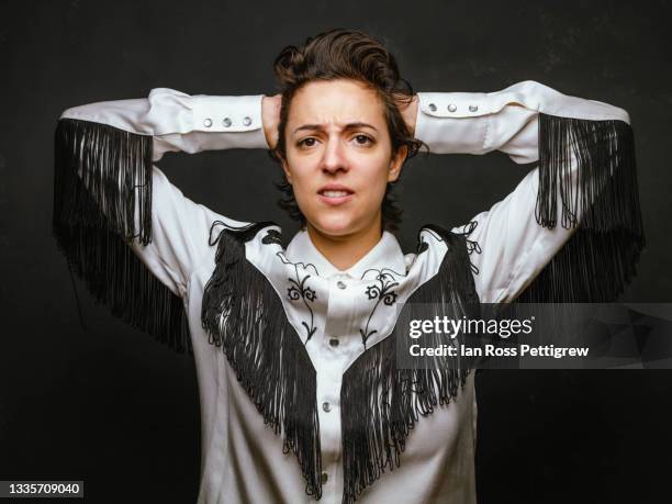 androgynous young woman, cowboy shirt - western shirt stockfoto's en -beelden