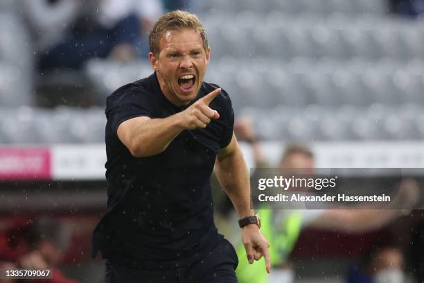 Julian Nagelsmann, Head Coach of FC Bayern Muenchen celebrates their side's third goal scored by Serge Gnabry of FC Bayern Muenchen during the...