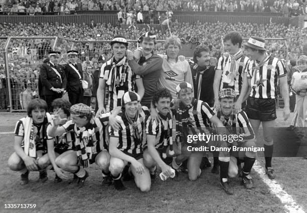 Newcastle players celebrate after their 4-0 victory over Derby County which all but seals Promotion to Division One, back row left to right, John...