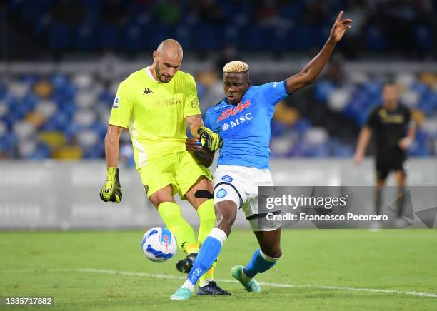 Victor Osimhen of SSC Napoli vies with Niki Maenpaa of Venezia FC during the Serie A match between SSC Napoli and Venezia FC at Stadio San Paolo on...