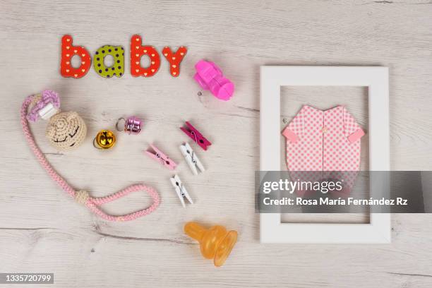 set of baby and toys  on light white rustic background. - origami alphabet stock pictures, royalty-free photos & images