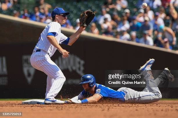 Hunter Dozier of the Kansas City Royals advances to second base after his RBI single in the second inning against Matt Duffy of the Chicago Cubs at...