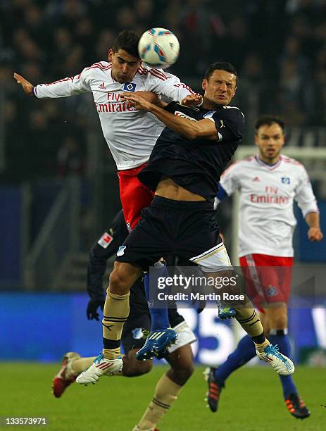 Tomas Rincon of Hamburg and Sejad Salihovic of Hoffenheim head for the ball during the Bundesliga match between Hamburger SV and 1899 Hoffenheim at...