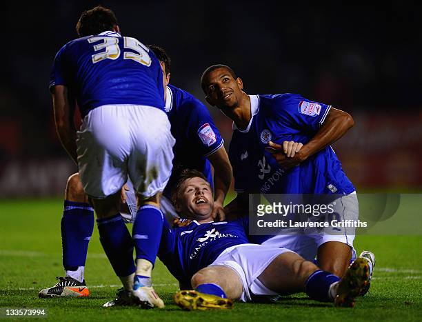 Paul Gallagher of Leicester City celebrates the third goal with David Nugent and Jermaine Beckford during the npower Championship match between...