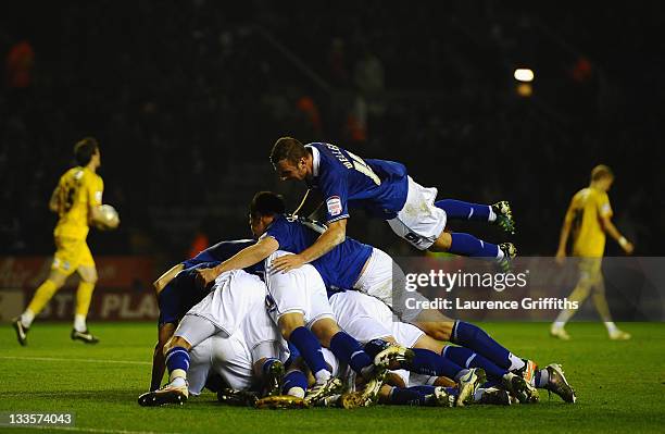 Paul Gallagher of Leicester City is mobbed after scoring the second goal with David Nugent and Jermaine Beckford during the npower Championship match...