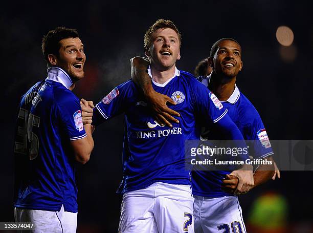 Paul Gallagher of Leicester City celebrates the third goal with David Nugent and Jermaine Beckford during the npower Championship match between...