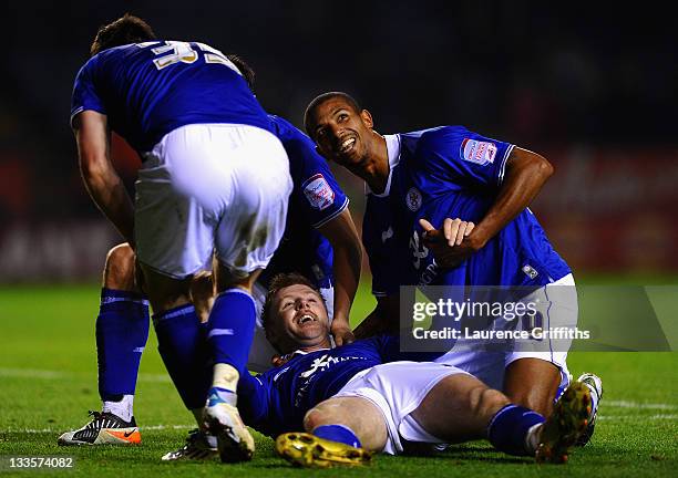 Paul Gallagher of Leicester celebrates the third goal with David Nugent and Jermaine Beckford during the npower Championship match between Leicester...