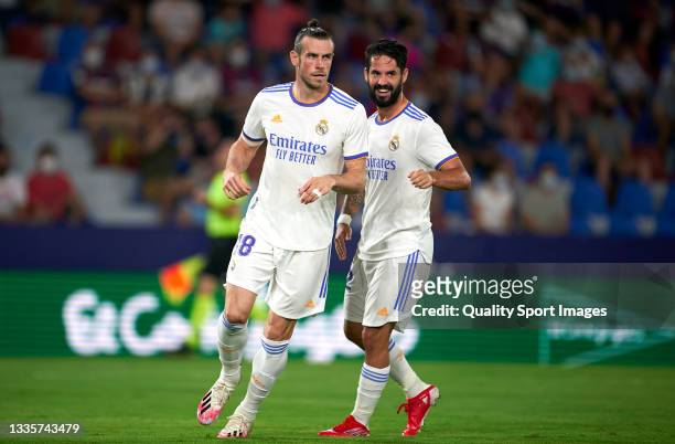 Gareth Bale of Real Madrid celebrates after scoring his team's first goal with his teammate Isco Alarcon during the La Liga Santander match between...