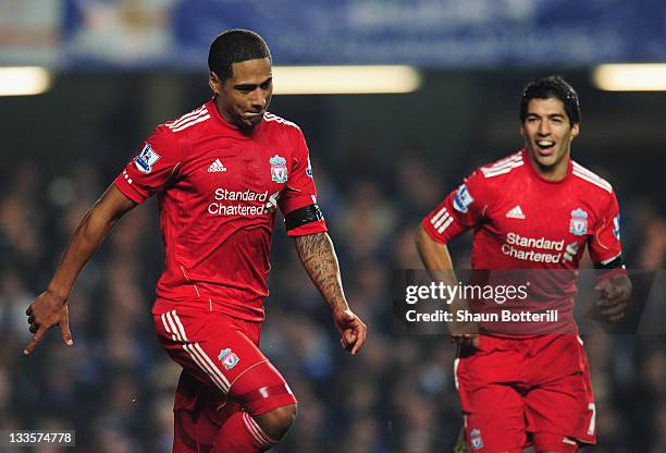 Glen Johnson of Liverpool celebrates his goal with Luis Suarez during the Barclays Premier League match between Chelsea and Liverpool at Stamford...