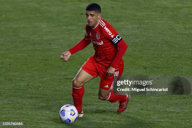 Taison of Internacional controls the ball during a match between Santos and Internacional as part of Brasileirao 2021 at Vila Belmiro Stadium on...