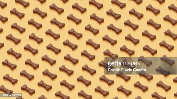 dog snack pattern background - croquette pour chien photos et images de collection