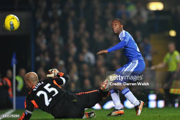 Daniel Sturridge of Chelsea scores past Jose Reina of Liverpool during the Barclays Premier League match between Chelsea and Liverpool at Stamford...