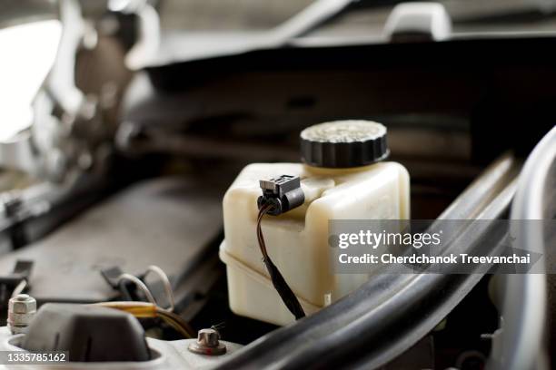 brake liquid storage tank in the car engine room - brake fluid reservoir stock pictures, royalty-free photos & images