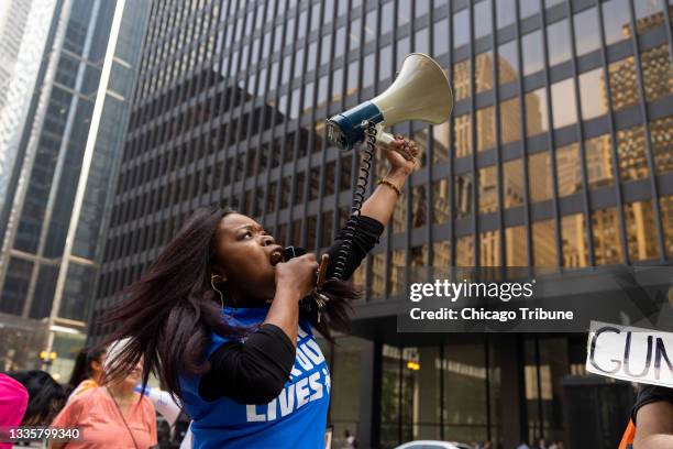 Erica Nanton, a community organizer for St. Sabina Parish, leads a chant at the March For Our Lives rally outside the 7th U.S. Circuit Court of...