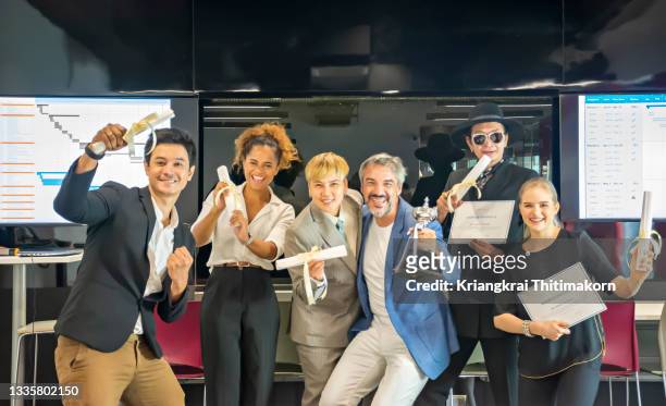 staff are celebrating after receiving the online studying certificates. - business awards ceremony stock pictures, royalty-free photos & images