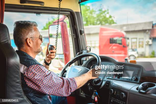 mature truck driver cb talking - walkie talkie stock pictures, royalty-free photos & images