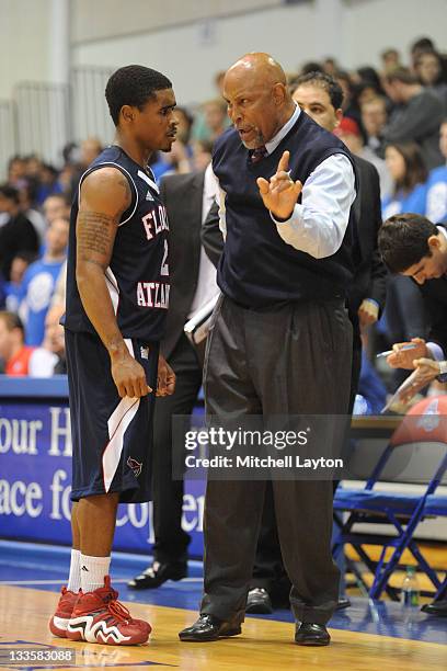 Raymond Taylor and head coach Mike Jarvis of the Florida Atlantic Owls talk during a college basketball game against the American Eagles at the...