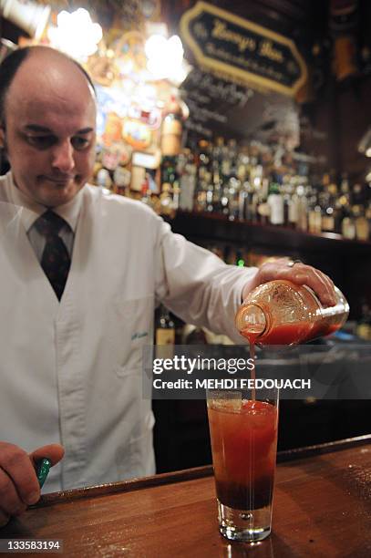 Waiter prepares a Bloody Mary cocktail on November 17, 2011 in Paris, at the famous Harry's New York Bar, where the Bloody Mary, the Side Car and...