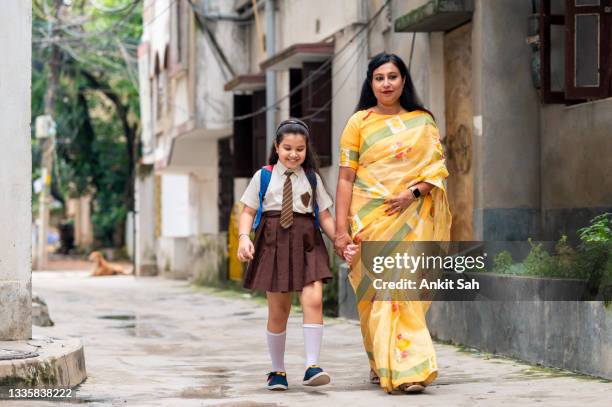 back to school- asian / indian mother leaving her daughter for school. - indian mother and child stock pictures, royalty-free photos & images