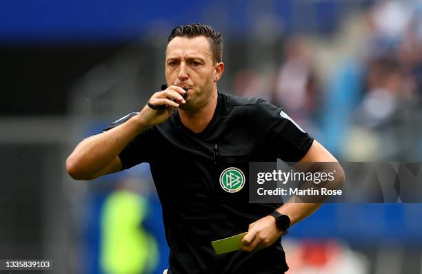 Referee Sven Jablonski reacts during the Second Bundesliga match between Hamburger SV and SV Darmstadt 98 at Volksparkstadion on August 22, 2021 in...