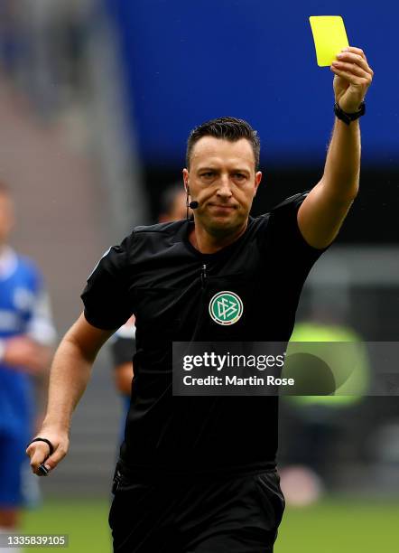 Referee Sven Jablonski reacts during the Second Bundesliga match between Hamburger SV and SV Darmstadt 98 at Volksparkstadion on August 22, 2021 in...