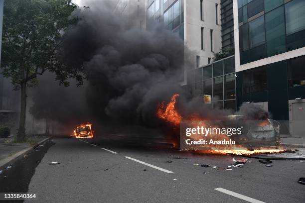 View of cars that are set on fire during a protest against the death of 17-year-old Nahel, who was shot in the chest by police in Nanterre on June...