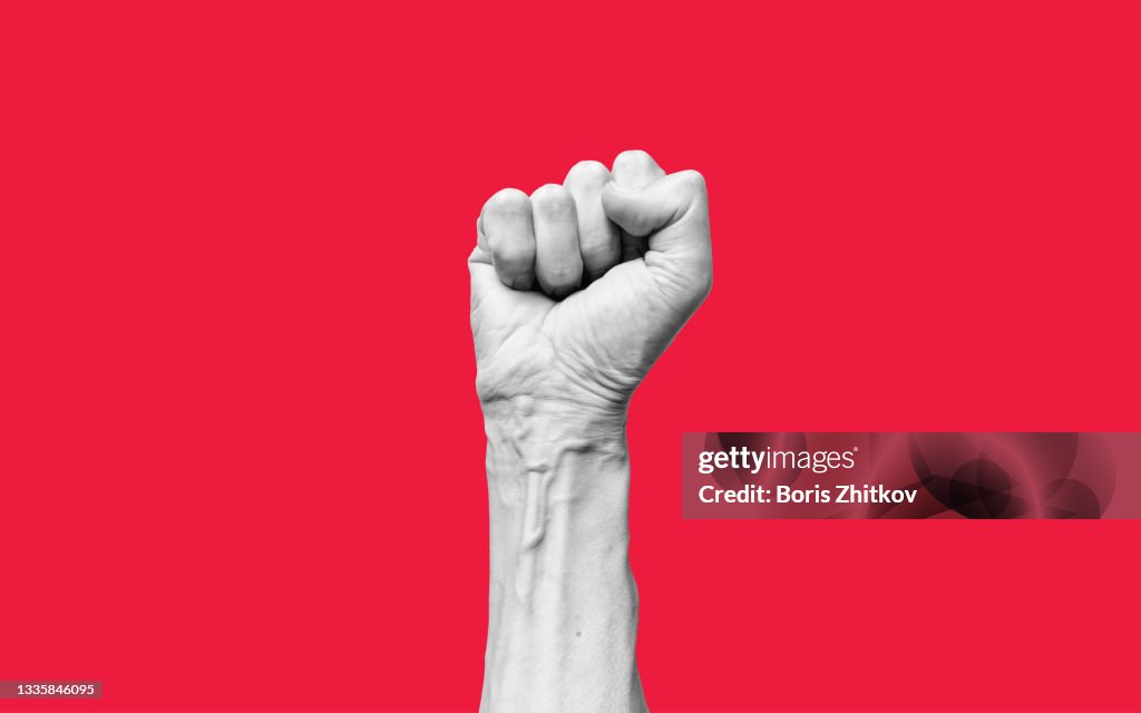 Raised fist.