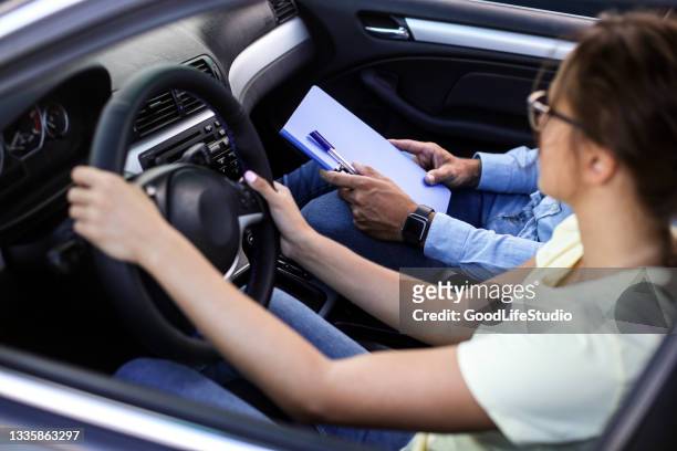 learning to drive - driving instructor stock pictures, royalty-free photos & images