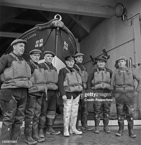 Coxswain William Brown, in centre, stands with the crew of the Royal National Lifeboat Institution Newbiggin lifeboat at the lifeboat station on the...