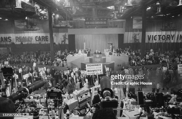 View from the press box over the heads of Republican Party supporters, a placard reads 'America needs Romney', at the 1968 Republican National...