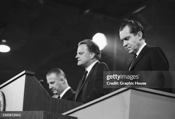 American Spiro politician Agnew , Governor of Maryland, American evangelist Billy Graham , and American politician Richard Nixon as Graham leads a...