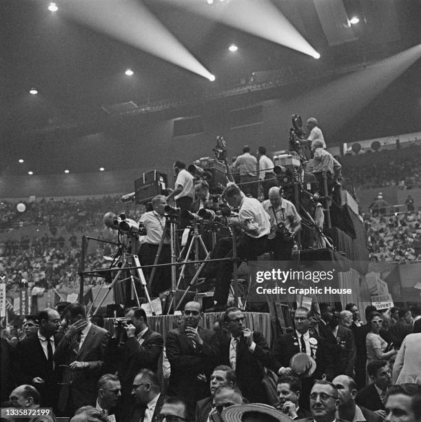 Photographers and camera operators on the press rostrum at the 1960 Democratic National Convention, held at the Los Angeles Memorial Sports Arena in...