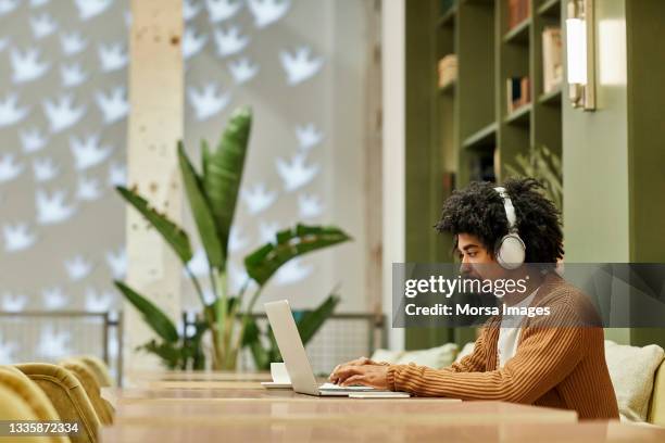 businessman using laptop in creative office - differential focus stock pictures, royalty-free photos & images