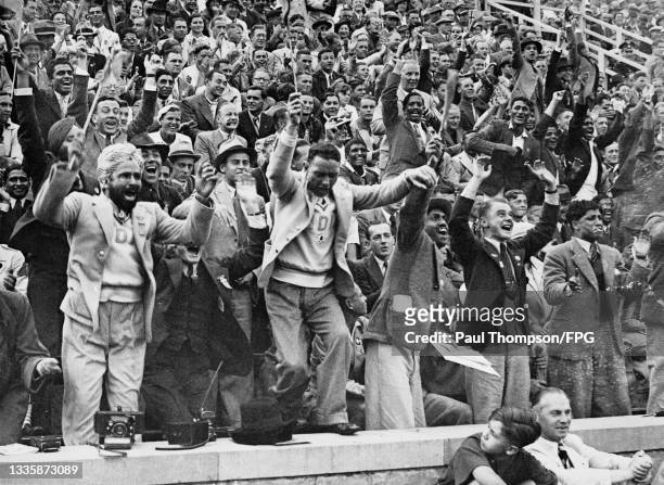 Unspecified Indian fans celebrate after India beat Germany in the field hockey final of the 1936 Summer Olympics, near the Olympiastadion in Berlin,...