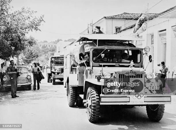 Nissan trucks at the start of the journey to be undertaken by the Olympic flame at Olympia, Greece, 27th June 1961. The trucks, carrying scientists...